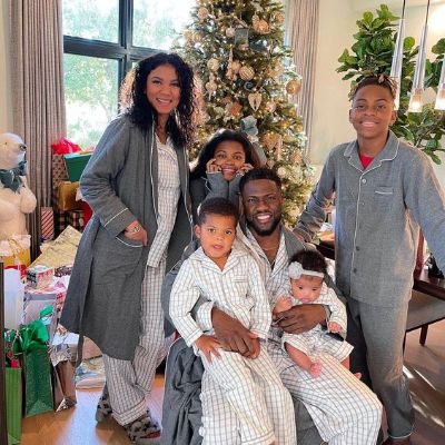 Eniko and Kevin with their kids celebrating Christmas.
